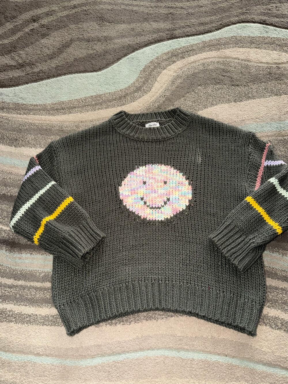 Petal Dew pullover features pastel rainbow smiley face vibrant  Medium